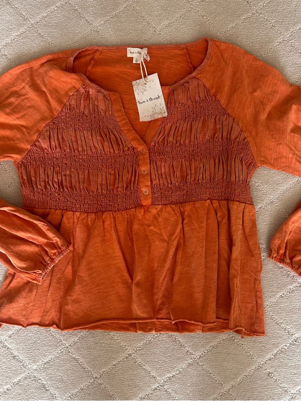 Hem and Thread Orange Smocked Peasant Top